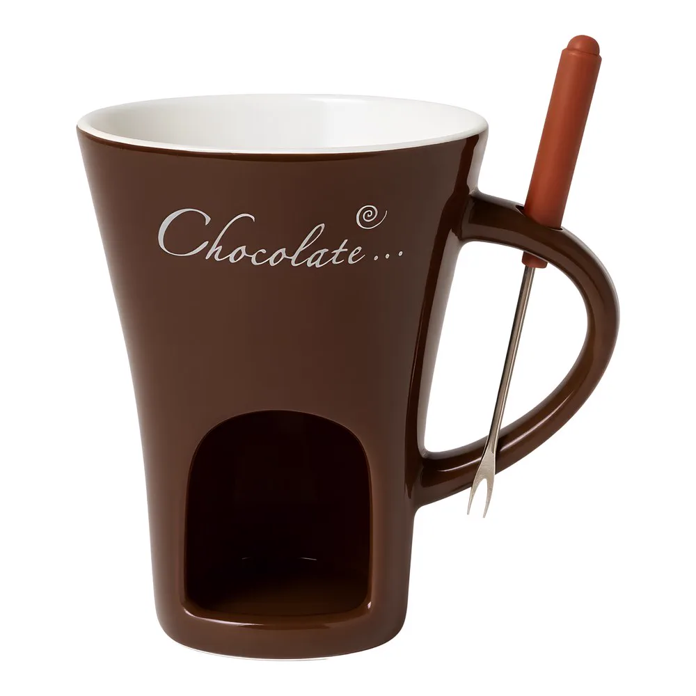 Studio shot of the brown fondue mug: the arch in the base, the loop handle with the fork clipped in and the white interior.